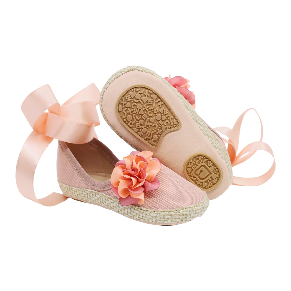 Coqueta para niña en textil rosa One con moño y flor decorativa