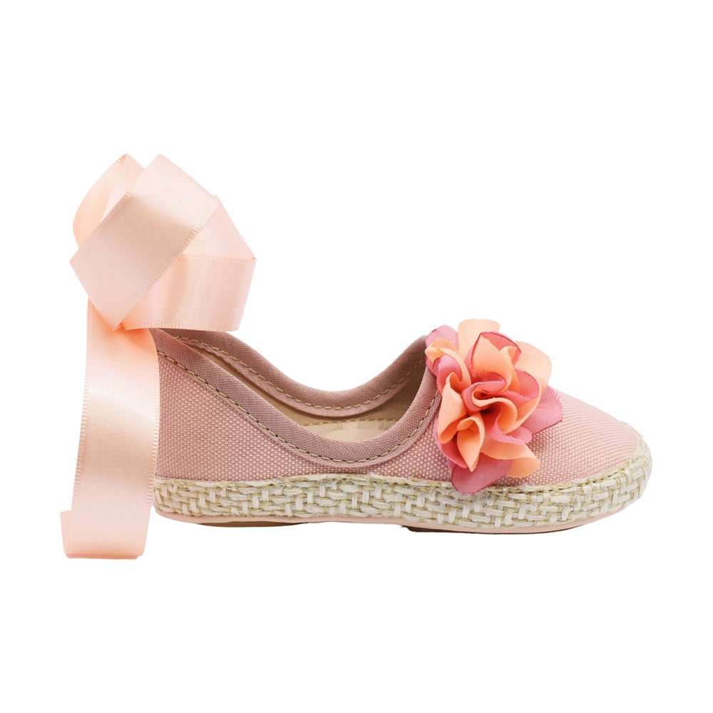 Coqueta para niña en textil  rosa One con moño y flor decorativa