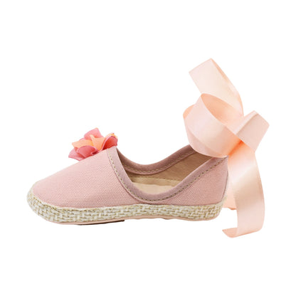 Coqueta para niña en textil  rosa One con moño y flor decorativa