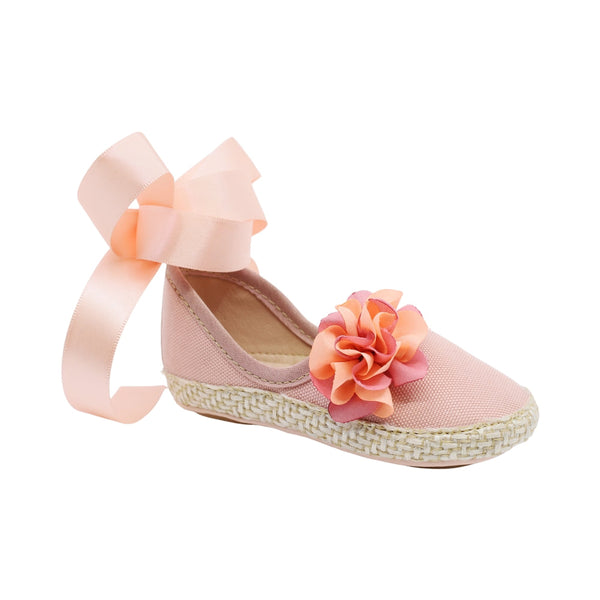 Coqueta para niña en textil  rosa One con moño y flor decorativa